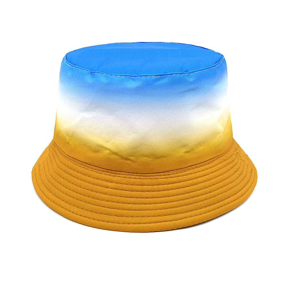 Kids bucket hat with blue, white, and yellow sunset gradient, wide brim